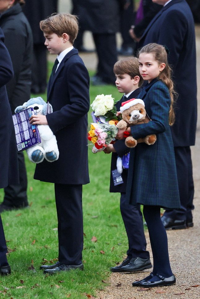 Britain's Prince George, Prince Louis and Princess Charlotte hold gifts received from well-wishers, on the day of the Royal Family's Christmas Day service at St. Mary Magdalene's church, as the Royals take residence at the Sandringham estate in eastern England, Britain December 25, 2024. REUTERS/Toby Melville