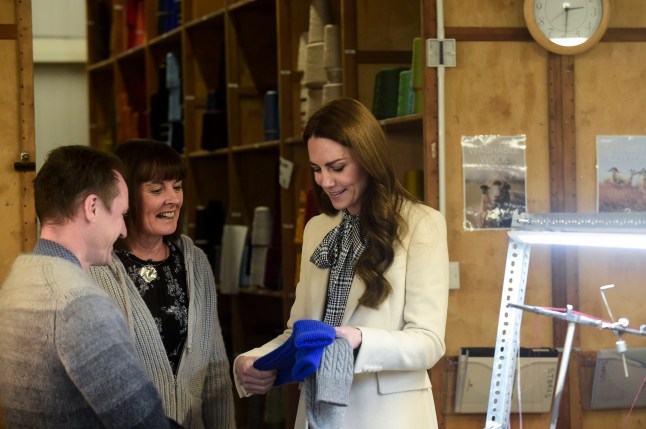 The Princess of Wales meets members of the production team during a visit to Corgi, a textiles manufacturer in Ammanford, South Wales, focused on the production of socks and knitwear. Picture date: Thursday January 30, 2025. PA Photo. See PA story ROYAL Kate. Photo credit should read: Rebecca Naden/PA Wire