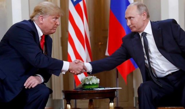 President Donald Trump, left, and Russian President Vladimir Putin shake hands at the beginning of a meeting at the Presidential Palace in Helsinki, Finland, July 16, 2018