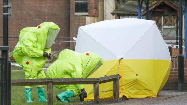 File photo dated 08/03/18 of personnel in hazmat suits working to secure a tent covering a bench in the Maltings shopping centre in Salisbury, where former Russian double agent Sergei Skripal and his daughter Yulia, were found critically ill by exposure to Novichok nerve agent. A third Russian spy faces charges of attempted murder over the Salisbury Novichok poisonings. Issue date: Tuesday September 21, 2021. PA Photo. Denis Sergeev, who used the alias Sergey Fedotov while in the UK, faces a string of charges including trying to kill former Russian spy Sergei Skripal, his daughter Yulia and ex-police officer Nick Bailey. See PA Story POLICE Salisbury. Photo credit should read: Andrew Matthews/PA Wire