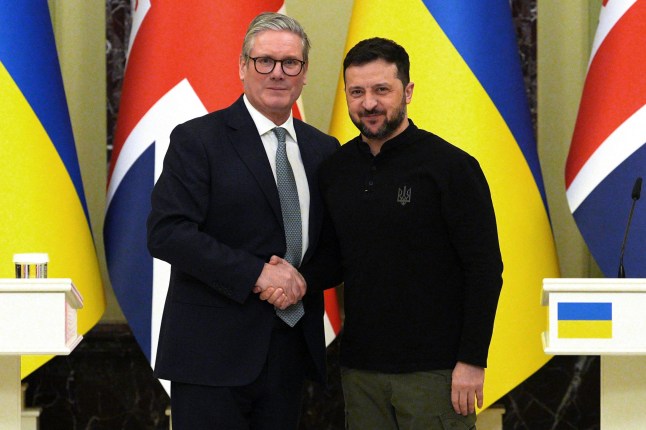 Sir Keir Starmer and Volodomyr Zelensky shaking hands.