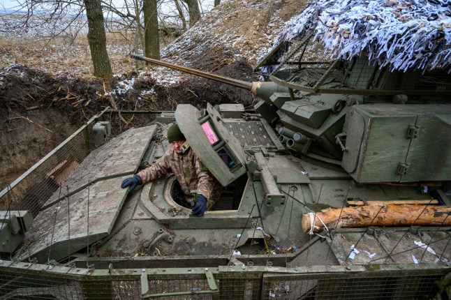 SUMY, UKRAINE - JANUARY 15: A driver who gave the name Yevhen sits in his vehicle, as Ukrainian Army soldiers use American Bradley Fighting Vehicles during Ukraines on-going cross-border operation into Russias Kursk region, where they have fought both Russians and an estimated contingent of 12,000 North Korean troops, on January 15, 2025 in Sumy, Ukraine. Ukrainian officers of the 4th Company, 1st Battalion, 82nd Separate Air Assault Brigade say that this American military hardware has been crucial to their ability to cross into Russia last August, as well as to Ukraines border defense against Russias all-out invasion in February 2022. Senior Ukrainian commanders and officials have expressed concern that deep U.S. military and financial support will ease up or stop with the incoming Trump Administration, which has stated that it would swiftly end the three-year war. (Photo by Scott Peterson/Getty Images)