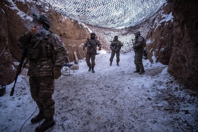 epaselect epa11905248 Members of the Joint Assault Brigade 'Lyut' of the Ukrainian National Police await orders at their artillery position on the Toretsk front line, Donbas, Ukraine, 18 February 2025. At this position they operate a self-propelled howitzer 2S22 Bohdana (Ukrainian for Given by God) which has a range of up to 42 kilometers and uses 155-millimeter ammunition, making it one of the most valuable pieces the Ukrainian artillery has at the moment. In one day they can fire its cannon between 20 and 40 times. EPA/Maria Senovilla