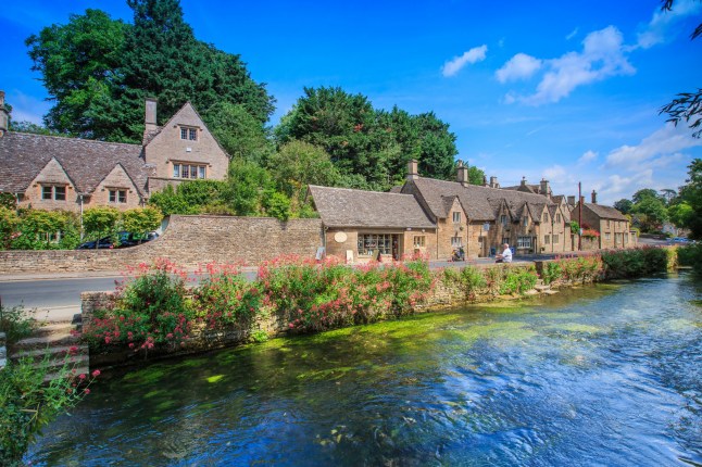 BIBURY, ENGLAND, UK - JULY 9, 2014: Arlington Row traditional Cotswold stone cottages in Gloucestershire on JULY 9, 2014, England. Bibury it the most depicted village in the world.; Shutterstock ID 481444468; purchase_order: -; job: -; client: -; other: -