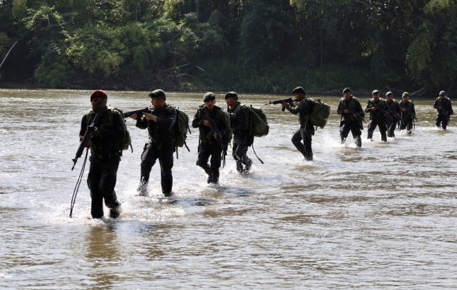 OCOS, GUATEMALA - MARCH 03: Guatemalan soldiers guard the Suchiate River, on the border with Mexico, during the sending of troops to stop migrants and drugs on March 03, 2025 in Ocos, Guatemala. Guatemala deployed troops on its border with Mexico to stop the passage of migrants and drugs. This measures comes in the wake of US President Donald Trump's immigration policies. (Photo by Jose Torres/Anadolu via Getty Images)