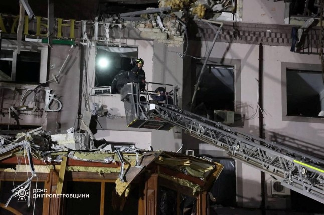 Rescuers work at the site of a hotel building hit by a Russian missile strike, amid Russia's attack on Ukraine, in Kryvyi Rih, Dnipropetrovsk region, Ukraine, in this handout picture released March 6, 2025. Press service of the State Emergency Service of Ukraine in Dnipropetrovsk region/Handout via REUTERS ATTENTION EDITORS - THIS IMAGE HAS BEEN SUPPLIED BY A THIRD PARTY. DO NOT OBSCURE LOGO.