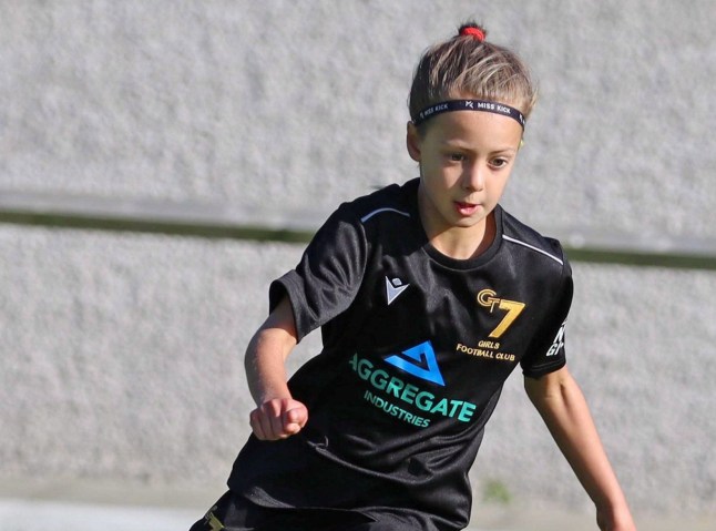 Poppy Atkinson playing football