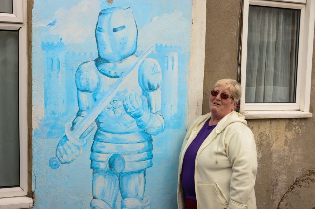 Dave Courtney???s neighbour, Sheila Wellcome, speaks about the side of the infamous gangster-turned-author that the public never saw. Pictured: Camelot Castle in Plumstead, including its exterior and rooftop featuring a controversial message. The property, purchased for ??500,000 in 2024 by its new owner, has undergone extensive renovations after being reportedly stripped bare before his move-in. He claims significant work was required to restore it to a livable condition.