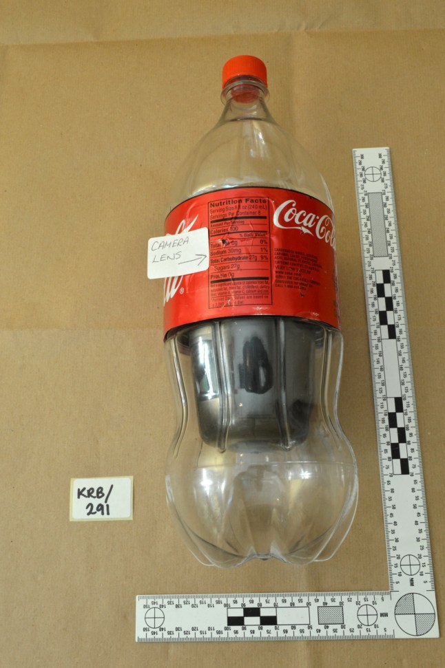 An undated Metropolitan Police handout photo of a Coca Cola bottle fitted with a video camera, in London, Britain. Three Bulgarian nationals are on trial at the Old Bailey accused of being part of a Russian spy ring. Metropolitan Police/Handout via REUTERS THIS IMAGE HAS BEEN SUPPLIED BY A THIRD PARTY