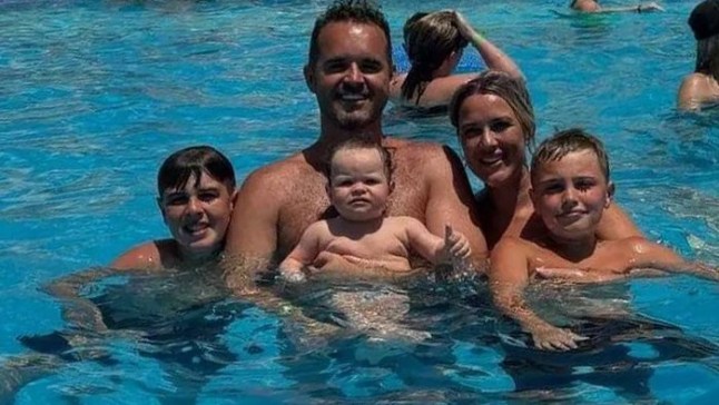 Natasha Sargeant and her family and Sienna-Rose in a swimming pool.