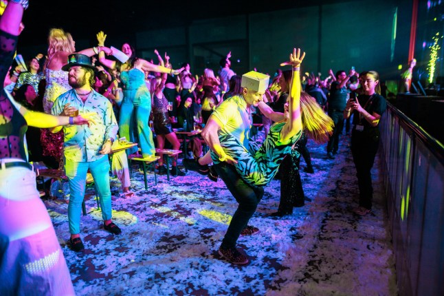 ? Joel Goodman - 07973 332324 - all rights reserved . 08/03/2025. Liverpool , UK . Participants dance in front of the stage. A Bongo's Bingo night at the ACC Exhibition Centre in Liverpool. The organisers say 3,500 people had paid for tickets for the business' 10th Anniversary event, which sees traditional bingo paired with novelty prizes, nostalgic 1980s and 1990s music, dance and stage performances.. Photo credit : Joel Goodman