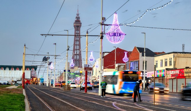 Blackpool, United Kingdom - October 20, 2024: Street of Blackpool with tourist attractions at dusk.