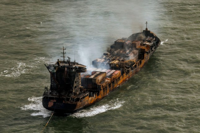 Smoke billows from the MV Solong cargo ship in the North Sea, off the Yorkshire coast in England, Tuesday, March 11, 2025. (Dan Kitwood/Pool Photo via AP)