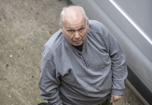 Richard Burrows arriving at Chester Crown Court in handcuffs