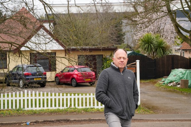 EAST ANGLIA NEWS SERVICE, tel 07767 413379 Adrian Day who is furious about the new giant warehouse looming over the back of his home in Nacton near Ipswich, Suffolk.