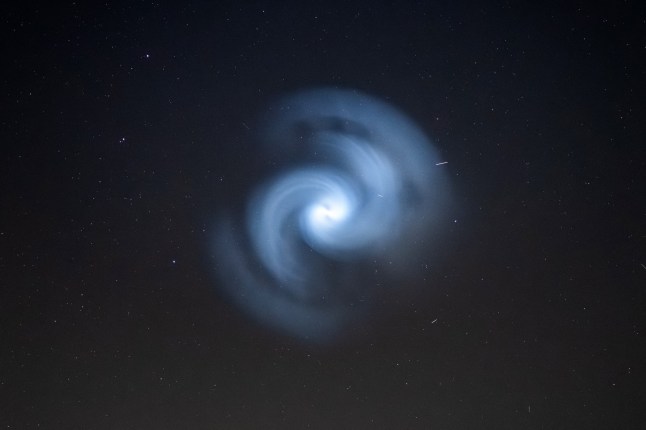 An unusual sight in the sky tonight (Monday) at 8pm, what is thought to be remnants from a rocket launch, likely excess fuel released by a SpaceX rocket which was seen across the UK. Captured from a garden in Colyton, Devon. 24/03/25. Please credit: Tim White/pictureexclusive.com Standard reproduction rates apply, contact Paul Jacobs, Picture Exclusive to arrange payment - 07923 866166, pictureexclusive@gmail.com