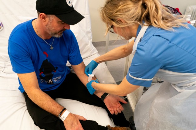 EMBARGOED TO 0001 FRIDAY APRIL 26 Nurse Eleanor Ferguson after administering infusion to patient Steve Young, having received his first jab at the University College London Hospital (UCLH) in London, for an international clinical trial testing a novel cancer immunotherapy which may prevent skin cancer from recurring. The mRNA-based technology in this study is aimed at people who have already had high-risk melanomas removed. Picture date: Thursday April 11, 2024. PA Photo. See PA story HEALTH Cancer. Photo credit should read: Jordan Pettitt/PA Wire