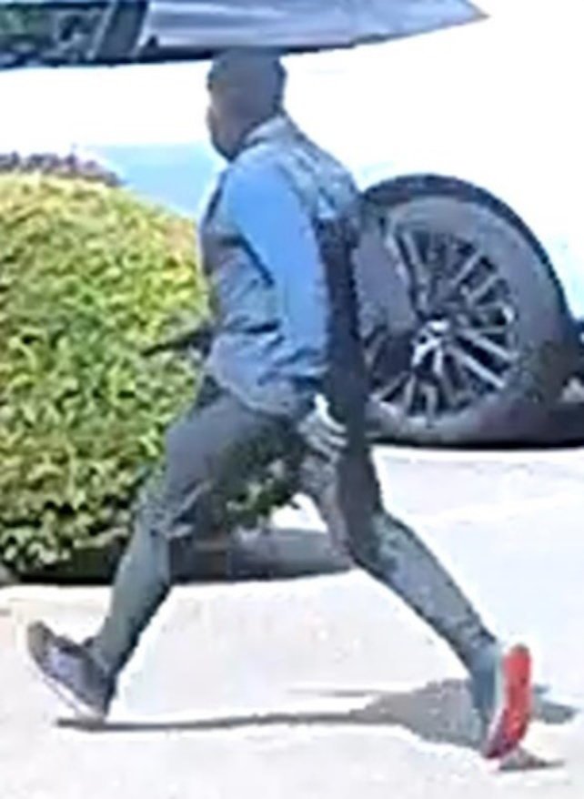 CCTV image of a suspect wanted by police in relation to stolen jewellery from a property near Wildernesse Golf Club club in Sevenoaks, Kent. Photo released July 26 2024. Police have released CCTV footage and photos in their hunt for a thief who violently stole jewellery worth nearly ?2m from a home. The burglary happened at a property near Wildernesse Golf Club club in Sevenoaks, Kent, when a woman was threatened and struck in the head with what is believed to be a handgun. Detectives have released CCTV images of a man travelling on a train and wearing a face mask, cream-coloured baseball cap and trainers with distinctive red soles. Police also issued photos of the expensive, diamond and gold-encrusted jewellery said to have been taken in the robbery.