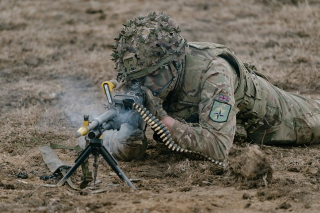 SMARDAN, ROMANIA - FEBRUARY 17: A British soldier shoots his gun during an exercise on February 17, 2025 in Smardan, Romania. The UK's 1st Division is commanding land forces during Exercise Steadfast Dart, as NATO Allied Reaction Force (ARF) training continues in Romania. The ARF was established in July 2024 amid a restructuring of the Alliance's high-readiness forces, with the capability of rapidly reinforcing NATO's eastern flank. The exercise includes 10,000 service personnel from nine nations, carried out across Romania, Greece, and Bulgaria during January and February. Steadfast Dart marks the first full-scale operational deployment of ARF, and this week coincides with the third anniversary of Russia's large-scale invasion of Ukraine in 2022. (Photo by Andrei Pungovschi/Getty Images)