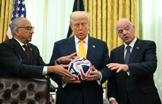 FIFA president (F??d??ration Internationale de Football Association) Gianni Infantino (R) presents US President Donald Trump with the new FIFA Club World Cup official ball in the Oval office of the White House, in Washington, DC, on March 7, 2025. (Photo by Jim WATSON / AFP) (Photo by JIM WATSON/AFP via Getty Images)