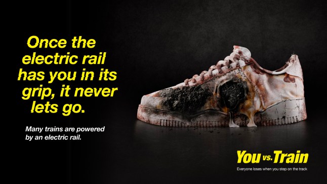 A Network Rail train track safety campaign poster showing the dangers of the third electric rail.