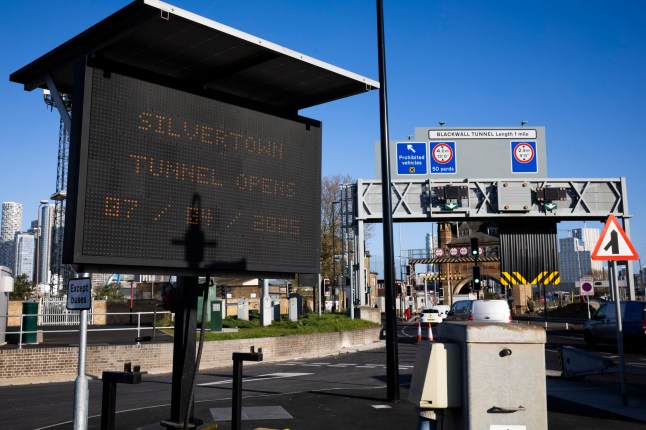 A road sign saying Silvertown Tunnel opens on April 7 in London.
