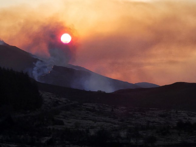 On Friday evening, two team members arrived at Caldons, Glentrool, in preparation for the early morning start setting up the Bruce's Crown Race. On arrival, they could see the orange glow of wildfire toward Buchan Ridge. They drove to Bruce's Stone car park to try and get a better view of the fire's location. They noticed a few cars parked at Bruce's Stone and immediately became concerned about wild campers in the area. They still could not determine where the fire was, so they drove to Culsharg Bothy. On arrival, they could view the full extent of the fire and location. At this point, they alerted the team leader, who alerted the emergency services and expressed concern about possible campers in the area. At 0020hrs a full team callout was put out. The team arrived at Stroan Bridge to meet with police and fire personnel. The police relocated the RV to Glentrool Hive. At the RV, police and a GMRT Incident Manager inquired about the campers' location. Police obtained phone number and sent out phone finds. At approximately 3:30 am, a phone find located two campers north of Little Spear. A hill party deployed and made its way up Kirriereoch to pick up the campers on Little Spear. They were both safely located and evacuated from the hill. While this was happening, Rescue 199 from Prestwick located campers in the Loch Valley region and got them to safety. The last remaining campers were located around 10am not far from Bruce's Stone. During the day team members assisted using the team drone to assess different areas. At 330pm new information from FLS staff confirmed that the fire was spreading north quickly toward Loch Doon and had also moved to the south of Loch Dee. Team members assisted police officers alerting residents and campers in the Loch Doon and Clatteringshaws areas, advising them about the fire. Our control vehicle was also deployed to Loch Doon to assist the police and also act as spotters overnight. All team members were safely home by 4:00 a.m. this morning. We would urged anyone heading to the hills over the next week to take care and avoid lighting camp fires or using naked flames. It's an exceptionally dry period of weather we have been having and for the next week it is going to be very dry as well.