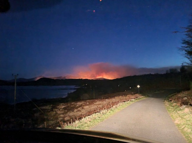 On Friday evening, two team members arrived at Caldons, Glentrool, in preparation for the early morning start setting up the Bruce's Crown Race. On arrival, they could see the orange glow of wildfire toward Buchan Ridge. They drove to Bruce's Stone car park to try and get a better view of the fire's location. They noticed a few cars parked at Bruce's Stone and immediately became concerned about wild campers in the area. They still could not determine where the fire was, so they drove to Culsharg Bothy. On arrival, they could view the full extent of the fire and location. At this point, they alerted the team leader, who alerted the emergency services and expressed concern about possible campers in the area. At 0020hrs a full team callout was put out. The team arrived at Stroan Bridge to meet with police and fire personnel. The police relocated the RV to Glentrool Hive. At the RV, police and a GMRT Incident Manager inquired about the campers' location. Police obtained phone number and sent out phone finds. At approximately 3:30 am, a phone find located two campers north of Little Spear. A hill party deployed and made its way up Kirriereoch to pick up the campers on Little Spear. They were both safely located and evacuated from the hill. While this was happening, Rescue 199 from Prestwick located campers in the Loch Valley region and got them to safety. The last remaining campers were located around 10am not far from Bruce's Stone. During the day team members assisted using the team drone to assess different areas. At 330pm new information from FLS staff confirmed that the fire was spreading north quickly toward Loch Doon and had also moved to the south of Loch Dee. Team members assisted police officers alerting residents and campers in the Loch Doon and Clatteringshaws areas, advising them about the fire. Our control vehicle was also deployed to Loch Doon to assist the police and also act as spotters overnight. All team members were safely home by 4:00 a.m. this morning. We would urged anyone heading to the hills over the next week to take care and avoid lighting camp fires or using naked flames. It's an exceptionally dry period of weather we have been having and for the next week it is going to be very dry as well.