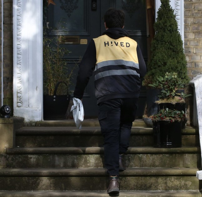 Kevin delivering parcel to home.