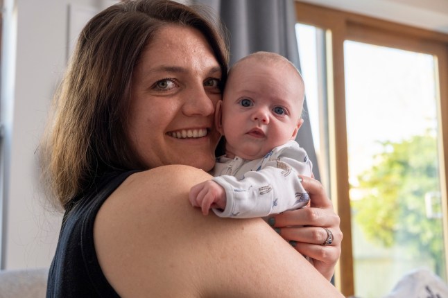 Adam and Lucy Isaac with their son Rafferty (11 weeks old), at home in Sonning, Berkshire. During pregnancy Rafferty was surgically removed and replaced in his mother's womb when it was discovered she had cancerous lesions. Adam had previously had a kidney transplant/ 10-4-2025 pic by Ian McIlgorm