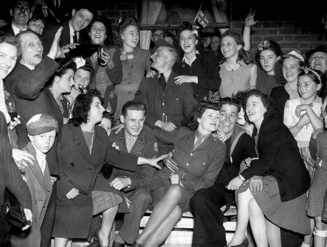 Embargoed to 0001 Wednesday April 29 File photo dated 08/05/45 of VE (Victory in Europe) Day celebrations in the East End of London, marking the end of the war in Europe. A teenage Princess Elizabeth danced in jubilation on VE Day after slipping into the crowds unnoticed outside Buckingham Palace. PA Photo. Issue date: Wednesday April 29, 2020. The future Queen, then just 19, and her sister Princess Margaret, 14, joined thousands of revellers as they gathered in front of the royal residence on May 8 1945. See PA story MEMORIAL VE Queen. Photo credit should read: PA/PA Wire