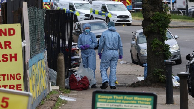 Forensic officers on Kingsbury Road.