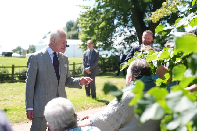 King Charles III speaks with well wishers after attending a Sunday church service at St Mary Magdalene Church in Sandringham, Norfolk. Picture date: Sunday July 28, 2024. PA Photo. See PA story ROYAL King. Photo credit should read: Joe Giddens/PA Wire