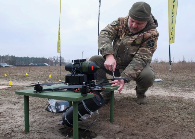 epa11861186 A Ukrainian soldier tests a fiber-optic-controlled drone designed for the Ukrainian Armed Forces, near Kyiv, Ukraine, 29 January 2025. Drones controlled by fiber optics can infiltrate enemy lines undetected by electronic warfare devices, and engage targets from outside the enemy's line of sight. EPA/VITALII NOSACH