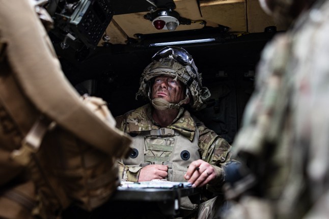 Soldiers take part in an urban combat exercise during a joint military manoeuvre between the French and British army at the Sissonne camp, north of the city of Reims, in northeastern France on April 22, 2025. Amid the soulless blocks of the ghost town of Jeoffrecourt, in north-eastern France, French and British soldiers train together in urban combat, learning the lessons of the war in Ukraine. (Photo by Sameer Al-DOUMY / AFP) (Photo by SAMEER AL-DOUMY/AFP via Getty Images)