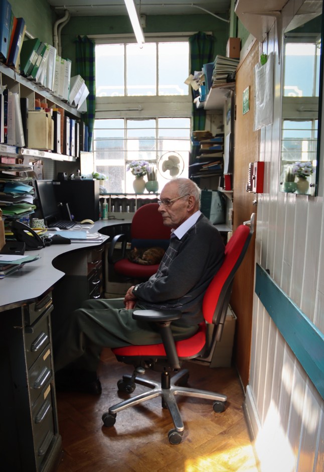 Graces Article - Peter Flitney rests in the office