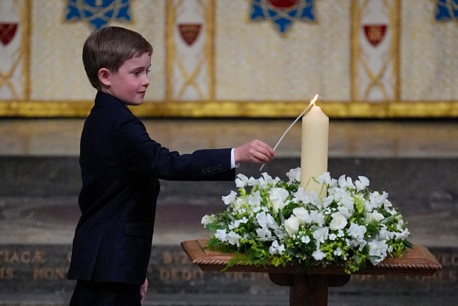 Great-great-grandson of Winston Churchill, Alexander Churchill, 10, lights the VE Day 80th Candle of Peace during a Service of Thanksgiving at Westminster Abbey in London on the 80th anniversary of VE Day. Picture date: Thursday May 8, 2025. PA Photo. See PA story MEMORIAL VEDay. Photo credit should read: Aaron Chown/PA Wire