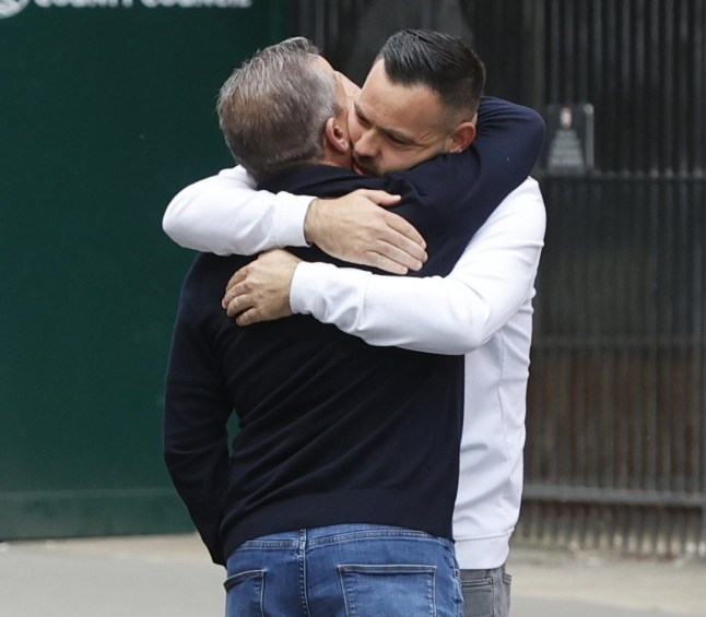 Fred Doe pictured hugging a friend outside of court.