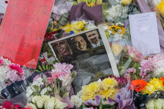 Flowers and tributes at the Bicester Motion Buildings in Bicester, Oxfordshire on May 19 2025 following the death of Martyn Sadler, Jennie Logan and David Chester after a fire broke on Thursday (May 15).