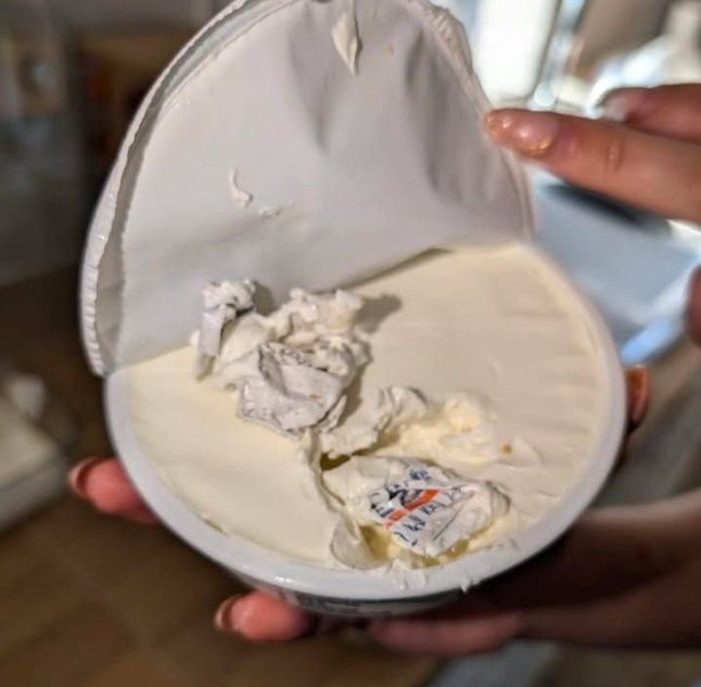 The Sainsbury's shopper's photo of what appears to be a clothing label, embedded in a sealed pot of mascarpone cheese