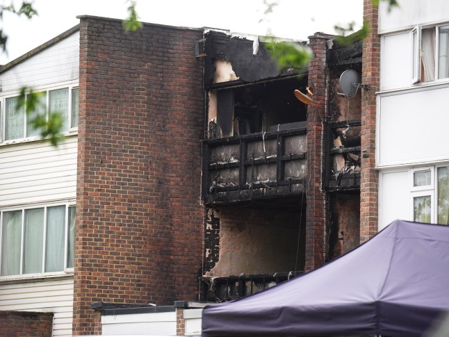 The scene in Tillett Close, Stonebridge, in Brent, north-west London, where a 15-year-old girl, two boys aged eight and four, and a 43-year-old woman died after a house fire in the early hours of Saturday. A 41-year-old man was arrested at the scene in connection with the incident and remains in custody. Picture date: Saturday May 24, 2025. PA Photo. See PA story POLICE Stonebridge. Photo credit should read: James Manning/PA Wire