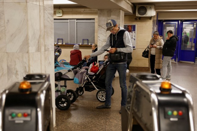 People take shelter inside a metro station during a Russian military strike, amid Russia's attack on Ukraine, in Kyiv, Ukraine, May 25, 2025. REUTERS/Alina Smutko