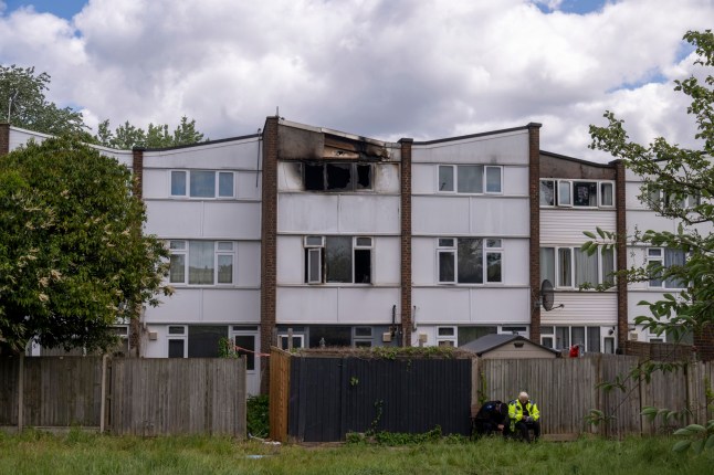 ?? Licensed to London News Pictures. 25/05/2025. London, UK. Flowers of condolence are placed near the scene of a burnt out house in Tilllett Close, Stonebridge Park, Brent, North West London. The fire started after midnight on Saturday 24th May. A 43-year-old woman and three children ??? a 15-year-old girl, an eight-year-old boy, and a four-year-old boy were pronounced dead at the scene. A 41-year-old man was arrested at the scene in connection with the incident and remains in police custody. Photo credit: Ray Tang/LNP