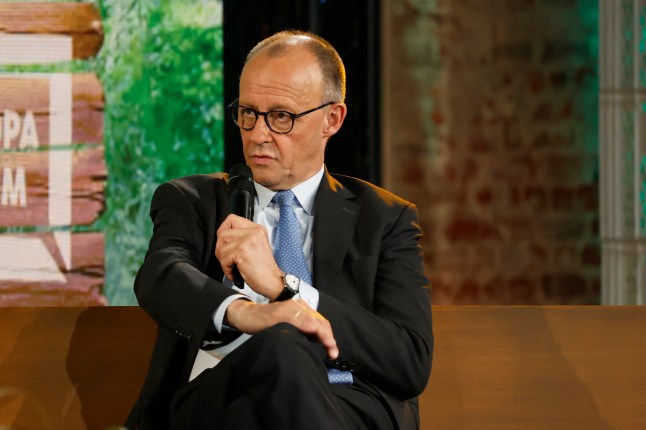 German Chancellor Friedrich Merz takes part in a discussion on 'Wars, crises, chancellorship: German answers to European questions' on stage of the 'Re:Publica 25' fair ground during the opening of the 'Re:publica 25' digital conference in Berlin on May 26, 2025. (Photo by Odd ANDERSEN / AFP) (Photo by ODD ANDERSEN/AFP via Getty Images)