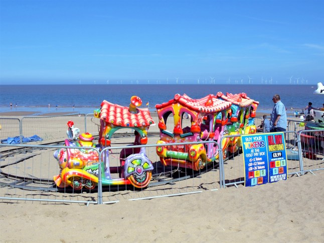 Ingoldmells, Lincolnshire, UK. July 17, 2014. Holidaymakers enjoying a children's train ride on the beach at Ingoldmells near Skegness in Lincolnshire, UK.; Shutterstock ID 1226817265; purchase_order: -; job: -; client: -; other: -