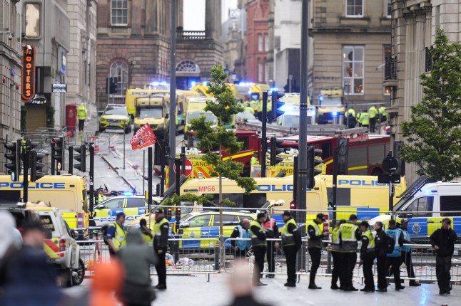 Police and emergency personnel dealing with a road traffic accident on Water Street near the Liver Building in Liverpool after a car collided with pedestrians during the Premier League winners parade. A man has been detained. Picture date: Monday May 26, 2025. PA Photo. See PA story POLICE Liverpool. Photo credit should read: Danny Lawson/PA Wire