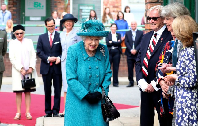 Mandatory Credit: Photo by Scott Heppell/WPA Pool/REX/Shutterstock (12200964d) Queen Elizabeth II visits the set of the long running television series Coronation Street, in Manchester, England. Queen Elizabeth II visits the set of Coronation Street, Manchester, UK - 08 Jul 2021