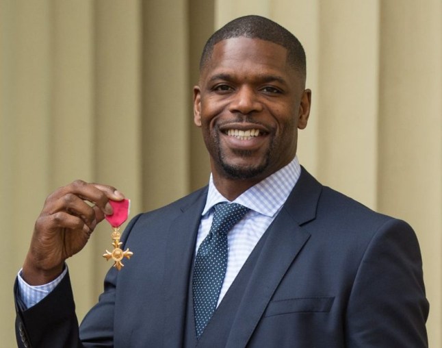 British boxer and founder of The Kiyan Prince Foundation, Mark Prince, poses with his medal after being appointed Officer of the Order of the British Empire (OBE) for services to tackling knife and gang crime in London during an investiture ceremony at Buckingham Palace in London on March 19, 2019. (Photo by Dominic Lipinski / POOL / AFP)DOMINIC LIPINSKI/AFP/Getty Images