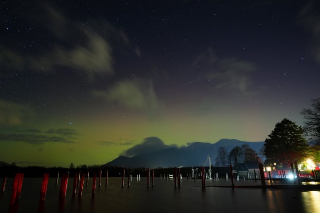 The aurora borealis, also known as the northern lights over Derwentwater, near Keswick in Cumbria. A three-day yellow warning for snow has been issued for almost all of England and Wales and parts of Scotland this weekend as the Met Office warned that rural communities could become cut off. Picture date: Wednesday January 1, 2025. PA Photo. Photo credit should read: Owen Humphreys/PA Wire