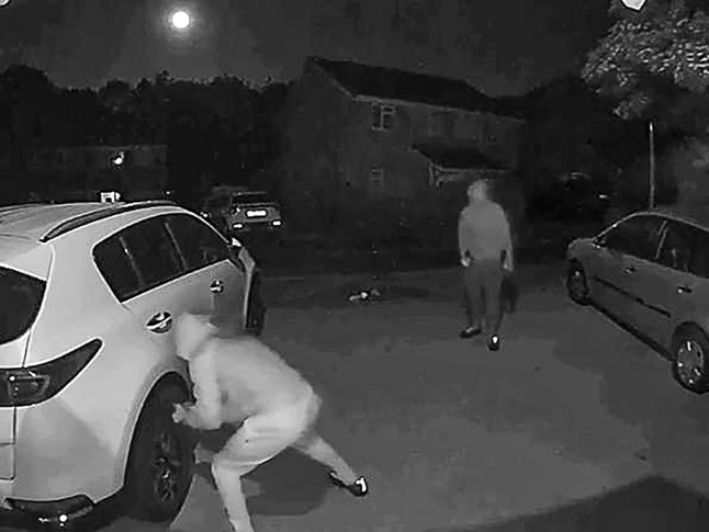 Pictured: CCTV footage of the attack on a property on Allbrook Knoll, Eastleigh. Two care workers have been left 'terrified' after their family home was attacked by three hooded men who threw rocks into their children's bedroom. Their six year old daughter even asked 'Mummy, why would anyone want to hurt my windows?' following the late night assault which also saw eight tyres slashed. The mother, who only gave her name as Erica for fear of further attacks, and her unnamed husband heard the noise and thought there was an intruder in their home but when they went to investigate they only found smashed windows. They then rushed to check on their son and daughter's room where the pair found a smashed window and three rocks on their daughter's bed, Erica cut her foot on some glass in her rush to check on the children. SEE OUR COPY FOR DETAILS. Please byline: Daily Echo/Solent News ?? Daily Echo/Solent News & Photo Agency UK +44 (0) 2380 458800